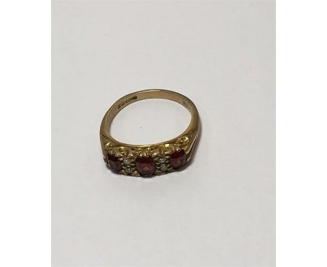 9ct Garnet and Diamond Victorian style ring, consisting of three garnets with four 'old cut' diamonds