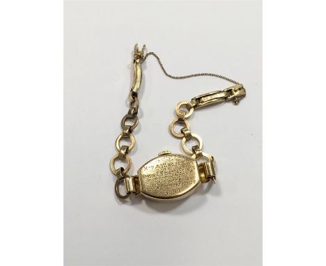 Vintage Ladies 9ct Gold Rolex Tudor wristwatch comes on 9ct Gold strap watch has engraved presentation on back cover total we