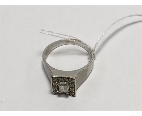 18 carat White Gold Baguette Diamond Ring. Hallmarked 750 set with central baguette Diamond that measures approx 5mm x 3mm su