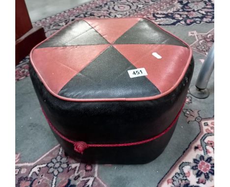 A vintage leatherette pouffe