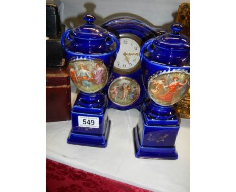 A ceramic clock garniture (one side piece a/f).