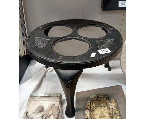 A cast iron warming tripod (Missing inserts)