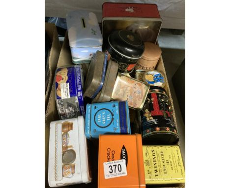 A box of vintage tins including tea Caddys