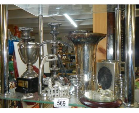 A mixed lot of silver plate including candlestick, vase, trophy etc.,