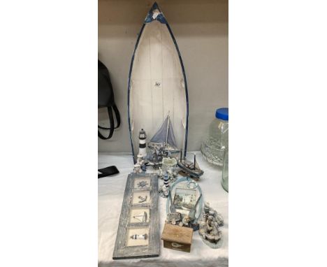 A quantity of Nautical ornaments &amp; Boat shaped shelf missing shelves