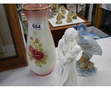 A Royal Worcester figure, an Ironstone vase and a bird figure.