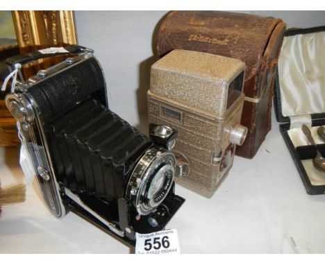 A G B Bell Howell vintage camera and an Agfa folding camera.