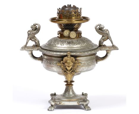 A 19TH CENTURY CAST WHITE METAL OIL LAMP of classical form decorated with sphinx finials and female masks, the square base wi