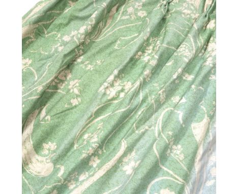A PAIR OF COTTON PRINTED CURTAINS on a green ground with a white repeating foliate motif, fully lined (some fading) 227cm in 