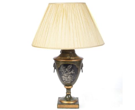 A CERAMIC TABLE LAMP in the form of a classical urn, the painted green ground with cartouches of Oriental figures, applied wi