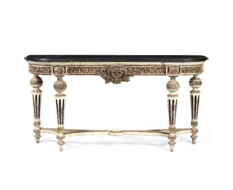 A 19TH CENTURY CONTINENTAL CONSOLE TABLE with shaped slate or black marble top and with foliate carved frieze and fluted turn