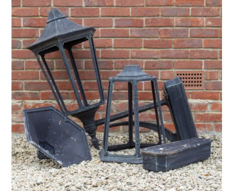 A LARGE BLACK PAINTED CAST METAL HEXAGONAL WALL LANTERN with instrinsic cats bracket, the lantern 44cm wide x 100cm high toge