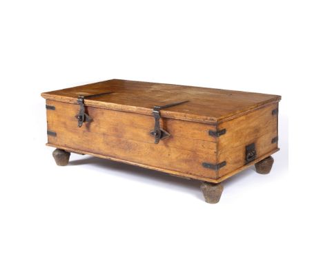 A LARGE HARDWOOD BOX OR TRUNK with iron bound corners, strapwork hasps and turned feet 161cm wide x 86cm deep x 58cm high 
