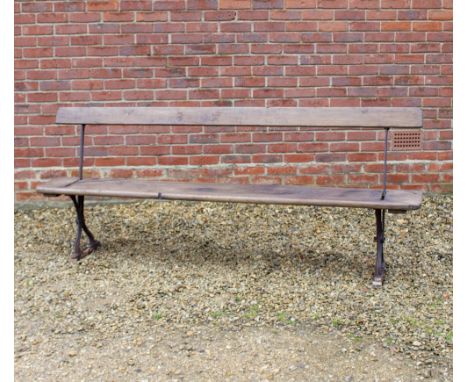 A LATE 19TH CENTURY ADJUSTABLE DOUBLE SIDED BENCH with cast iron ends 215cm wide 
