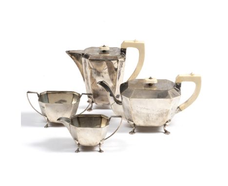 A FOUR PIECE ART DECO SILVER TEA SET  with teapot and water jug with ivory finials and handles, with milk jug and sugar bowl,