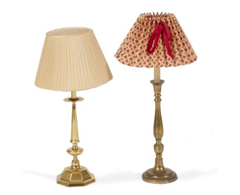 A BRASS TABLE LAMP in the form of a Georgian candlestick with circular stem and spreading base, the base 14cm diameter and th