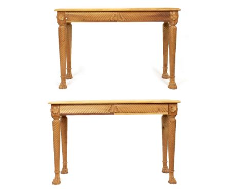 A PAIR OF MODERN HARDWOOD CONSOLE TABLES  with spiral turned supports and paw feet, each 139cm wide x 54cm deep x 90cm high (