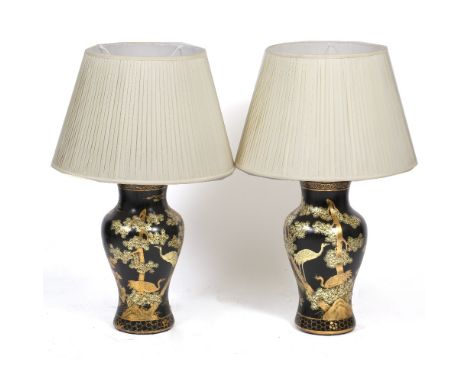 A PAIR OF BLACK LACQUERED CHINOISERIE PAPIER MACHE TABLE LAMPS of baluster form, decorated with scenes of deer and stalks in 