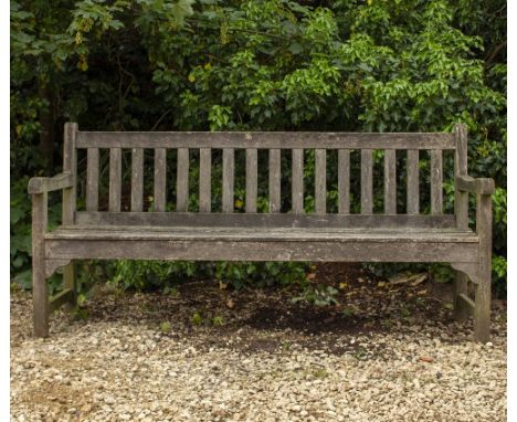 A TEAK SLATTED GARDEN BENCH by Freeland Wood Products, 182cm wide x 61cm deep x 85cm high