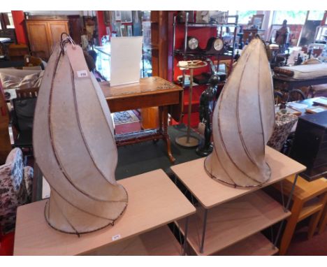 A pair of mid 20th century velum ceiling light shades of twisted form and purportedly from Liberty's. H-80cm D-40cm