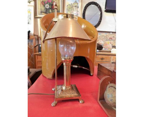 A pair of Georgian style brass table lamp with pad feet