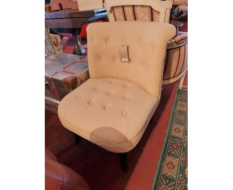 A pair of bedroom chairs upholstered in ivory linen with buttoned backs raised on ebonised cabriole supports H:73cm W:57cm D: