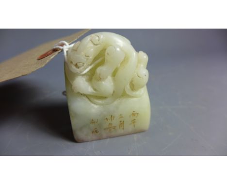 A Chinese soapstone seal carved with a dragon. H-5cm W-4cm D-2.5cm