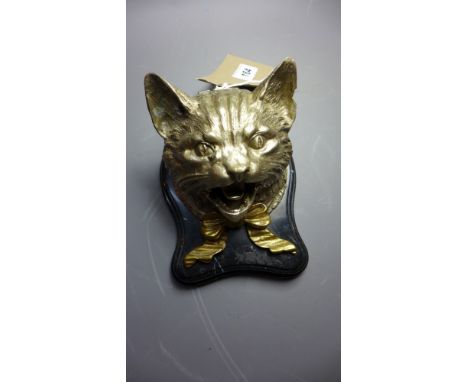 A white metal inkwell in the form of a cat with a bow tie on a marble base H:12cm W:18cm D:14cm