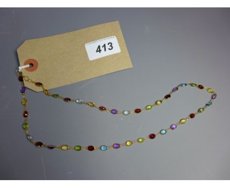 A 14ct gold, peridot, garnet, blue topaz, citrine and amethyst necklace
