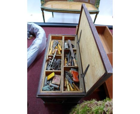 A large collection of vintage carpenter's tools in a painted pine tool chest with initials F.A.B.