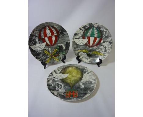 Three Piero Fornasetti 'Mongolfiere' ceramic plates, the reverse of each transfer printed 'MONGOLFIERE FORNASETTI MILANO MADE