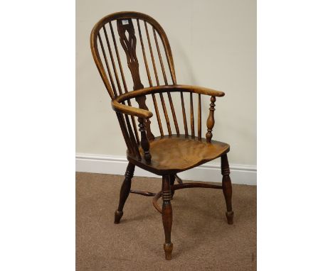 Early 19th century elm and ash Windsor armchair, crinoline stretcher, fretwork splat and stick back, dished seat