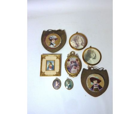 Pair continental circular ceramic plaques printed with female portraits H13.5cm overall and six other small framed portraits 