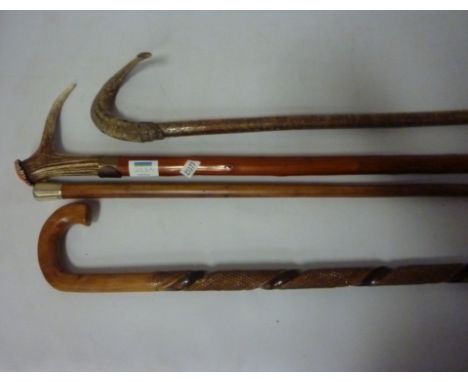 Malacca walking cane with hallmarked silver top, antler handled stick and two other walking sticks (4) 