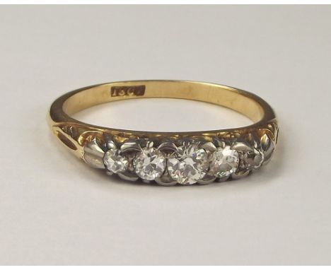 DIAMOND RING. An 18ct. gold five stone diamond ring. Size Q/R.