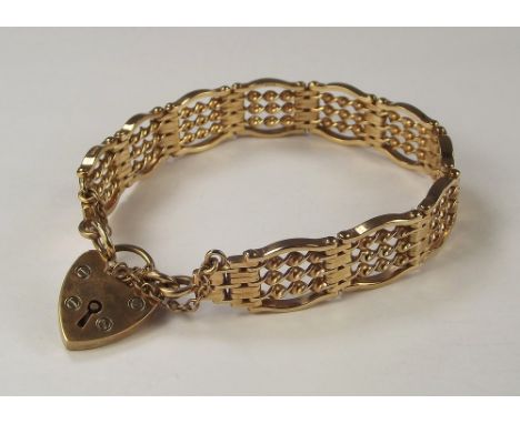 GOLD BRACELET. A 9ct. gold gate bracelet with 9ct. gold padlock clasp. Approx. 25.4g.
