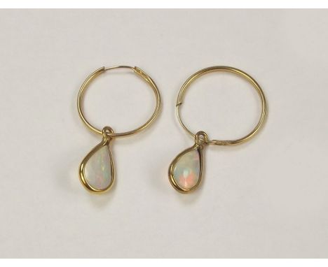 OPAL SLEEPERS. A pair of delicate 9ct. gold opal sleeper earrings.