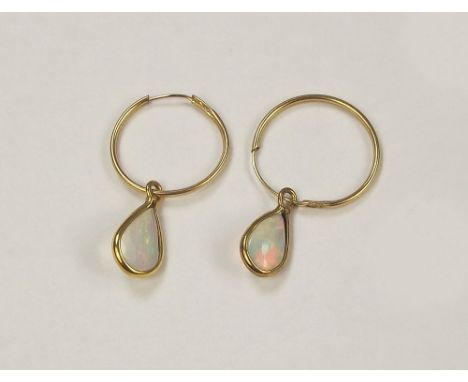 OPAL SLEEPERS. A pair of delicate 9ct. gold opal sleeper earrings.