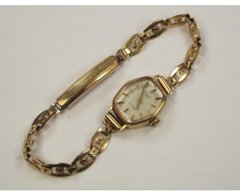 GOLD WATCH. A lady's 9ct. gold cased Rotary wristwatch, on gold plated strap.