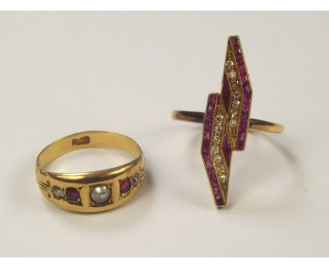 GOLD RINGS. A Victorian 18ct. gold pearl, ruby & diamond set ring, size J & a cocktail ring set with table cut rubies & brill
