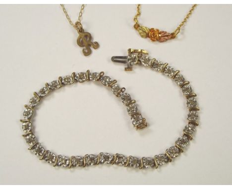 GOLD BRACELET ETC. A 10k. bracelet, a 10k. rose pendant on gold plated chain & an initial 'R' pendant on 10k. chain.