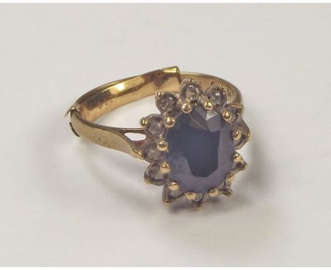 GOLD RING. A 9ct. gold sapphire set dress ring. Size K.