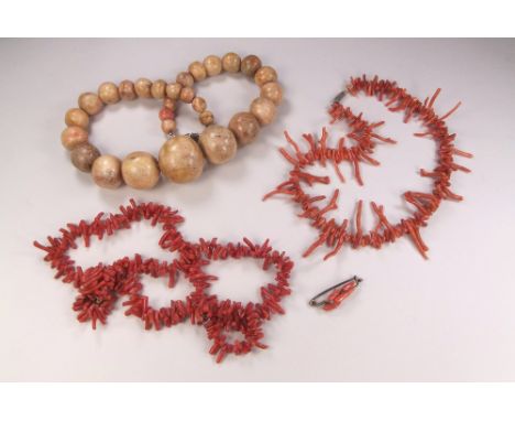 CORAL. A stick coral necklace, a three strand coral bracelet, sponge coral beads etc.