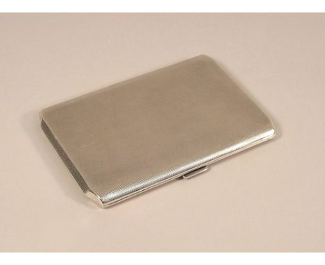 CIGARETTE CASE. A 1930's engine turned cigarette case, with canted corners. 12.5 x 8.5cm.