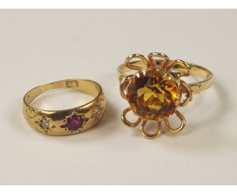 GOLD RINGS. An 18ct. gold & citrine dress ring, size R & a Victorian ruby & diamond ring, size H.