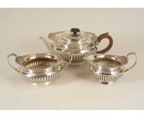 TEA SERVICE. A Victorian three piece tea service by Walter & John Barnard. London 1895. Approx. 34oz.