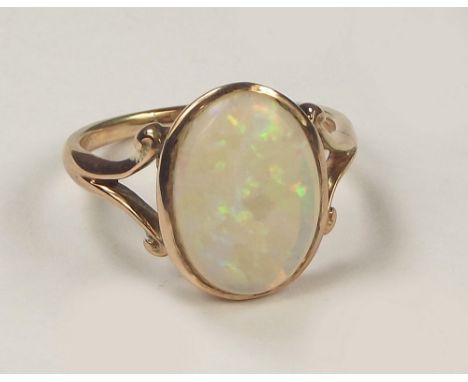 OPAL RING. A gold opal set ring. (Indistinct stamps) Size O/P.