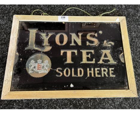A vintage Lyons' Tea glass advertising sign. [42x29.5cm]