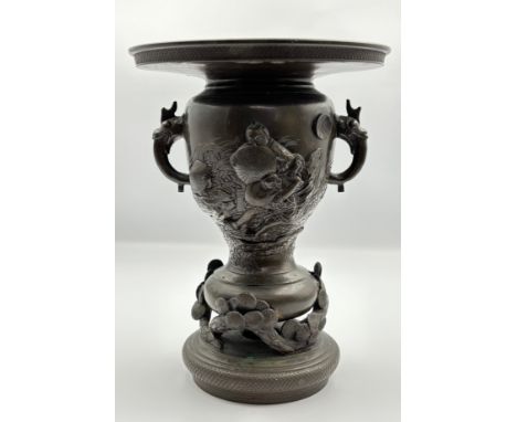 Late 19th century Bronze Chinese vase, highly decorative design and dragon handles, Height 24cm