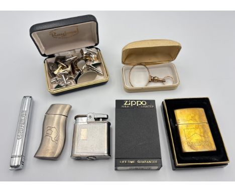 A collection of Cufflinks, Magnifying and a collections of lighters to include zippo.